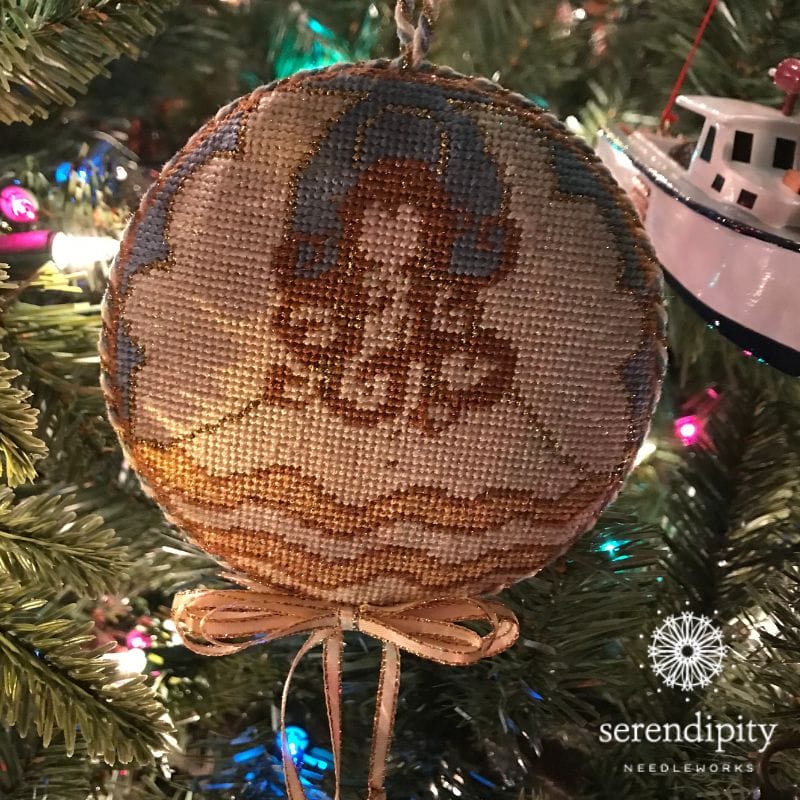 The angel ornament my friend Kelly stitched for me has tiny little bells attached to the ribbon streamers.