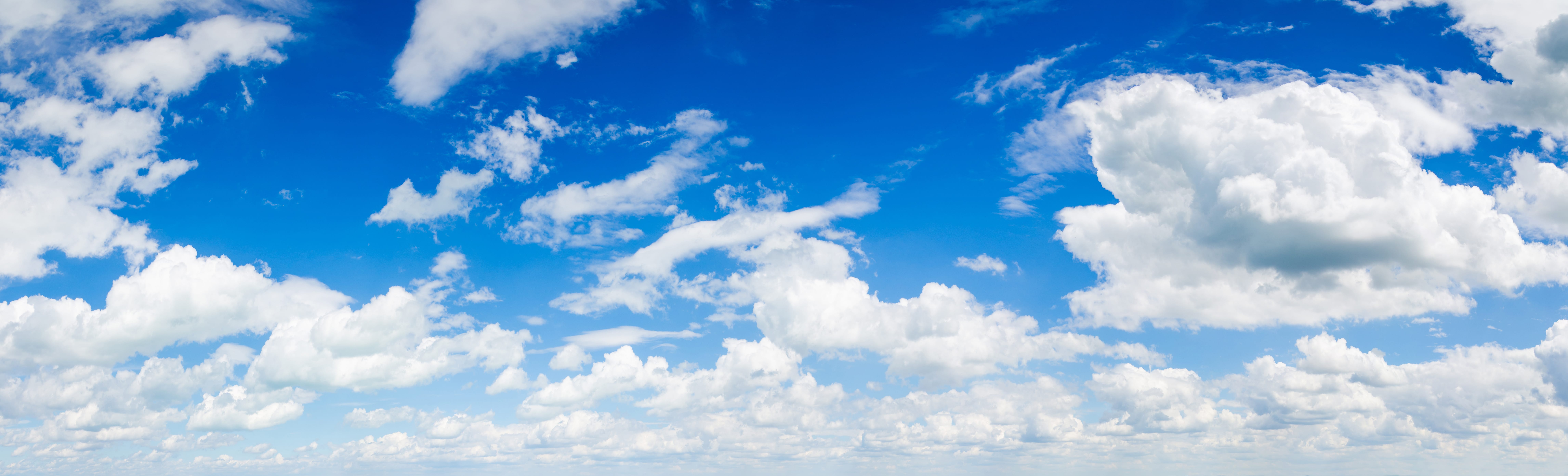blue sky background with clouds Beautiful blue sky with white wispy clouds.