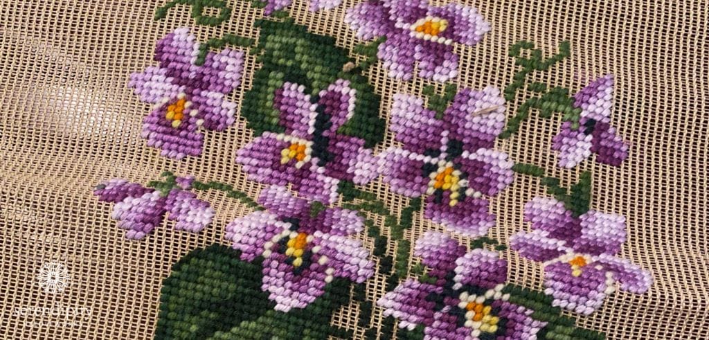 I learned to do needlepoint on a pre-worked needlepoint canvas like this one.