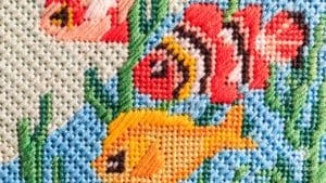 Needlepoint canvas embellished with decorative stitches