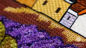 The lavender flowers are worked in French knots on this canvas by Maggie and Co., Lavender Fields.