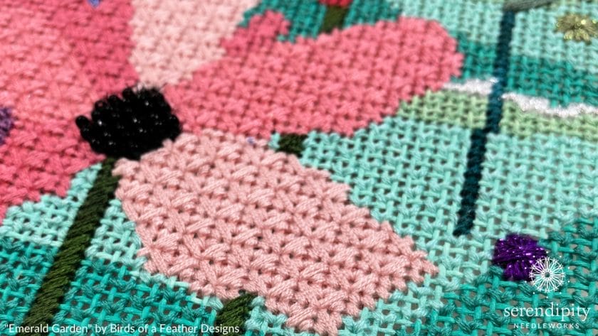 The pink flower petals are stitched in the reversed mosaic stitch.