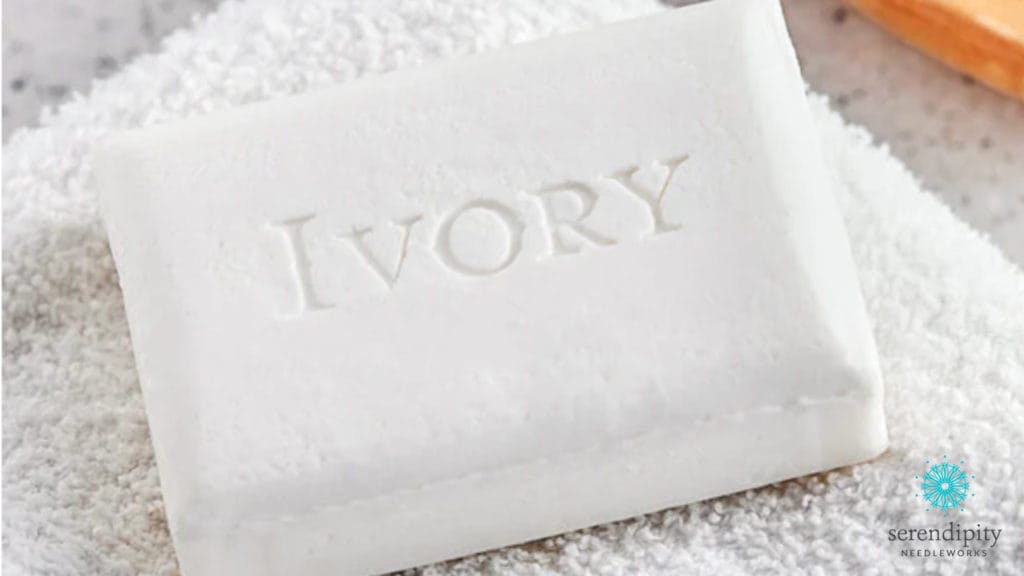 Ivory soap is a gentle cleaning agent that can be effectively used on needlepoint. (Spot test in an inconspicuous place first, though.)