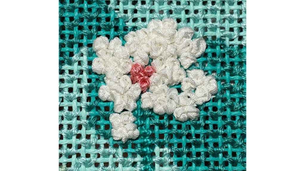 French knots can be used to make beautiful ribbon work flowers. 