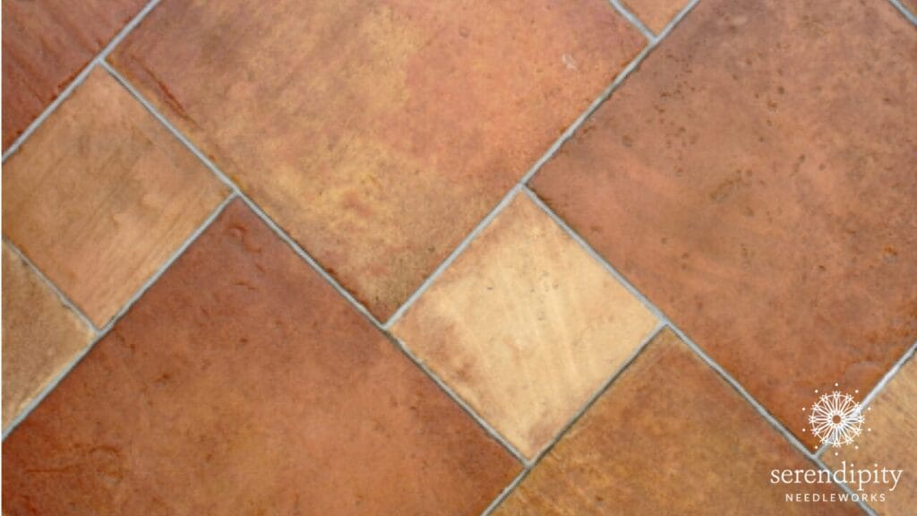 The serendipity stitch is a terrific option for stitching patterned tile or wood floors on your needlepoint canvases.