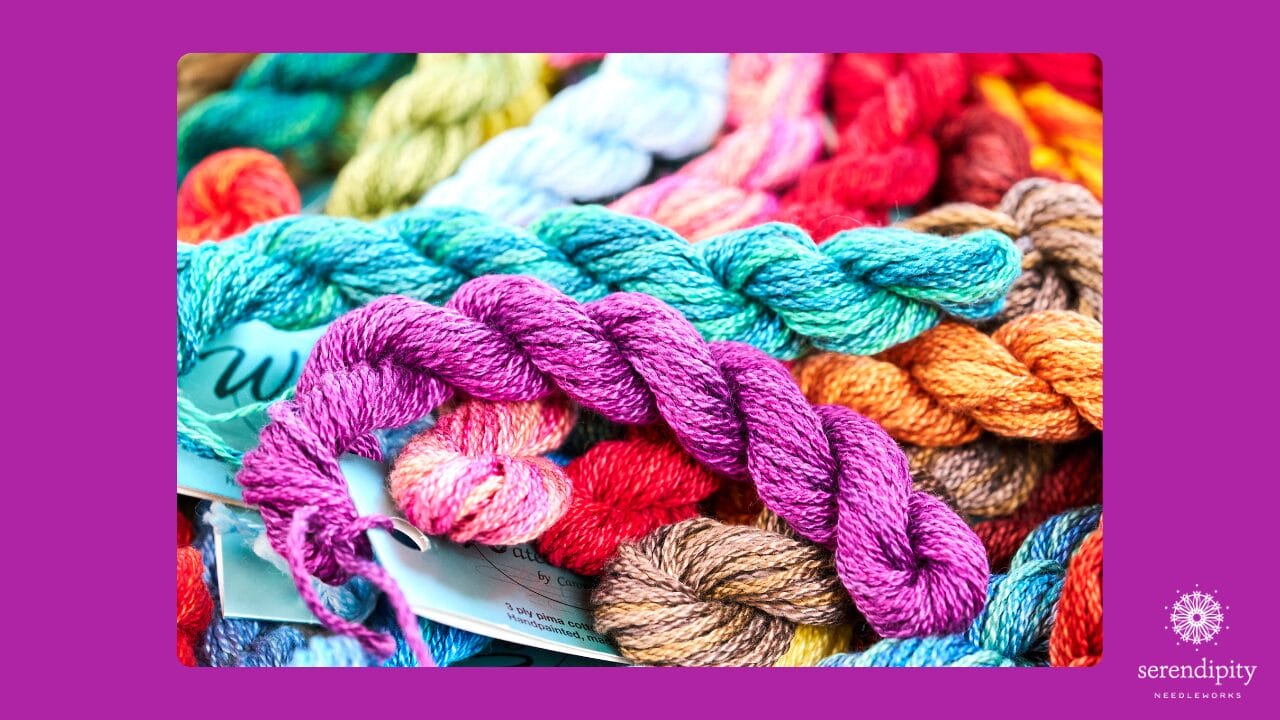 Colorful collection of specialty needlepoint threads including silk, metallics, and over-dyed threads for painted canvas needlepoint projects